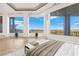 Bright main bedroom with floor to ceiling windows and city views at 1484 Macdonald Ranch Dr, Henderson, NV 89012