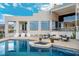 Inviting pool and spa area surrounded by modern outdoor furniture, perfect for relaxation at 1484 Macdonald Ranch Dr, Henderson, NV 89012