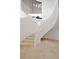 Bright and modern staircase with a winding design and neutral tones complementing the surrounding decor at 1484 Macdonald Ranch Dr, Henderson, NV 89012