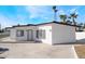 A modern home exterior with a minimalist design, black trim and a concrete driveway at 1613 Hartke Pl, Las Vegas, NV 89104