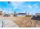 Exterior shot featuring a desert landscape, showcasing palm trees accenting this single story home at 1613 Hartke Pl, Las Vegas, NV 89104