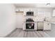 This is a lovely kitchen with stainless steel appliances, white cabinets, and light grey wood-look floors at 1613 Hartke Pl, Las Vegas, NV 89104