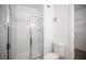 Bathroom featuring a standup shower with glass door and an open doorway to a walk-in closet at 1704 N Jones Blvd, Las Vegas, NV 89108