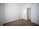 Comfortable bedroom with carpet, closet, and view into adjoing room at 1704 N Jones Blvd, Las Vegas, NV 89108