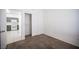 Bedroom with carpeted flooring, closet and view into kitchen area at 1704 N Jones Blvd, Las Vegas, NV 89108