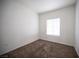 This bedroom features neutral carpeting, window and electrical outlets at 1704 N Jones Blvd, Las Vegas, NV 89108