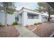 Charming condo with a tiled roof, covered entryway, and low-maintenance desert landscaping at 1704 N Jones Blvd, Las Vegas, NV 89108