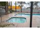 Relaxing hot tub with blue trim, surrounded by lush landscaping and ample space for community members at 1704 N Jones Blvd, Las Vegas, NV 89108