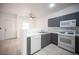 Efficient kitchen showing dishwasher, range, neutral color scheme and serving bar area at 1704 N Jones Blvd, Las Vegas, NV 89108