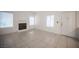 Bright living room features a decorative fireplace, tile flooring, and ample natural light at 1704 N Jones Blvd, Las Vegas, NV 89108