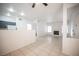 Bright living room features tile flooring, a cozy fireplace, and an open floor plan at 1704 N Jones Blvd, Las Vegas, NV 89108