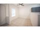 Living area with tile flooring and great natural light, flowing into the kitchen area at 1704 N Jones Blvd, Las Vegas, NV 89108