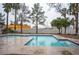 Inviting community pool with palm trees and blue tile accents for a relaxing outdoor experience at 1704 N Jones Blvd, Las Vegas, NV 89108