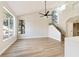 Airy living room featuring tall ceilings, a wall of windows, and lots of natural light at 2105 Cardigan Ave, North Las Vegas, NV 89032