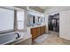 Bright bathroom featuring a soaking tub, dual sinks, and spacious walk-in closet at 2724 Monrovia Dr, Las Vegas, NV 89117