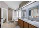 Bright bathroom features a soaking tub, shower, dual sink vanity with granite countertops, and a toilet at 2724 Monrovia Dr, Las Vegas, NV 89117