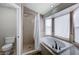 Well-lit bathroom featuring a soaking tub, shower, and toilet, offering a relaxing and functional space at 2724 Monrovia Dr, Las Vegas, NV 89117