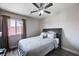 Bedroom with ceiling fan, hardwood flooring, and large comfortable bed at 2724 Monrovia Dr, Las Vegas, NV 89117