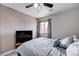 Cozy bedroom features a ceiling fan and a window providing natural light at 2724 Monrovia Dr, Las Vegas, NV 89117
