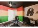 Bedroom with exercise equipment, painted walls, ceiling fan, and hardwood floors at 2724 Monrovia Dr, Las Vegas, NV 89117