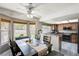 Bright dining area with backyard views, connected to kitchen featuring granite counters and stainless appliances at 2724 Monrovia Dr, Las Vegas, NV 89117