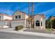 Inviting two-story home with a two-car garage and desert-friendly landscaping at 2724 Monrovia Dr, Las Vegas, NV 89117
