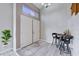 Bright foyer with double doors, modern flooring, and a cozy seating area at 2724 Monrovia Dr, Las Vegas, NV 89117
