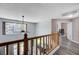 Second floor hallway boasting wood-look floors and a view of the living and dining areas below at 2724 Monrovia Dr, Las Vegas, NV 89117