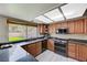 Kitchen features dark granite countertops and a stainless steel gas range at 2724 Monrovia Dr, Las Vegas, NV 89117