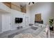 Bright living room features high ceilings, a comfortable gray sofa, and contemporary decor at 2724 Monrovia Dr, Las Vegas, NV 89117