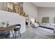 Open-concept living area with a staircase and modern gray flooring throughout at 2724 Monrovia Dr, Las Vegas, NV 89117