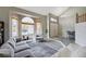 Bright living room showcases seamless layout, large windows, and modern decor at 2724 Monrovia Dr, Las Vegas, NV 89117