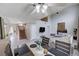 View of the living room, dining area, and staircase creates an inviting, open layout at 2724 Monrovia Dr, Las Vegas, NV 89117