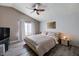Comfortable main bedroom with a ceiling fan, plush bed, and plenty of natural light from the window at 2724 Monrovia Dr, Las Vegas, NV 89117