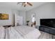 Bright main bedroom featuring wood-look floors and connecting to the bathroom and hallway via arched doorways at 2724 Monrovia Dr, Las Vegas, NV 89117