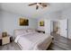 Spacious main bedroom with wood-look floors and two doorways: one to the bathroom and one to the hallway at 2724 Monrovia Dr, Las Vegas, NV 89117