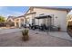 Backyard features a cozy covered patio and low-maintenance gravel landscaping at 2804 Gallant Hills Dr, Las Vegas, NV 89135