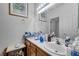 Bright bathroom features double sinks with framed mirror and overhead lighting at 2804 Gallant Hills Dr, Las Vegas, NV 89135