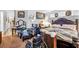 Spacious bedroom with dark wood furniture and personal items scattered at 2804 Gallant Hills Dr, Las Vegas, NV 89135