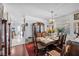 Formal dining area boasts a traditional chandelier, ornate furnishings, and adjacent living space at 2804 Gallant Hills Dr, Las Vegas, NV 89135