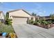 Charming single-story home with a two-car garage and an ADT security system sign at 2804 Gallant Hills Dr, Las Vegas, NV 89135