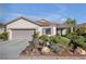 Charming single-story home with a well-manicured front yard and a two-car garage at 2804 Gallant Hills Dr, Las Vegas, NV 89135
