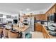 Well-lit kitchen with granite countertops, stainless steel appliances, and easy access to living area at 2804 Gallant Hills Dr, Las Vegas, NV 89135