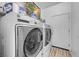 Laundry room featuring modern, front-load washer and dryer units at 2804 Gallant Hills Dr, Las Vegas, NV 89135