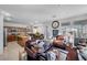 Spacious living area features a large wall clock, leather seating, and seamlessly connects to the kitchen at 2804 Gallant Hills Dr, Las Vegas, NV 89135