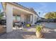 A covered patio features neutral toned stucco, gravel, and outdoor seating at 2804 Gallant Hills Dr, Las Vegas, NV 89135