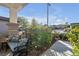 Charming front porch featuring a cozy bench amidst lush landscaping at 2804 Gallant Hills Dr, Las Vegas, NV 89135