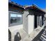 Exterior balcony features gray trim around a window and door, neutral tile, and a stucco exterior at 2818 Calle Del Oro, Las Vegas, NV 89120