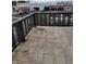 Exterior balcony shows a gray railing with neutral tile, and a street view beyond the railing at 2818 Calle Del Oro, Las Vegas, NV 89120