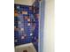 A unique bathroom with colorful tiled walls and a shower with a glass door, adding character to the space at 2818 Calle Del Oro, Las Vegas, NV 89120